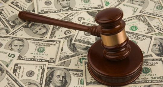 gavel laying over bills