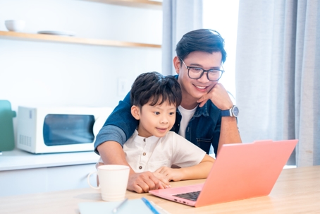 father and son on the computer
