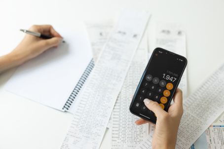 person calculating expenses