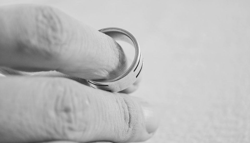 hand holding wedding ring